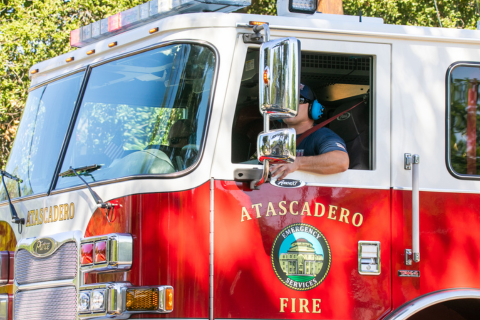 Close up on Atascadero Fire Truck with the department's logo clearly visible on the door of the engine.