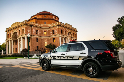 Atascadero Police Department vehicle with the Historic Atascadero City Hall building in the background.