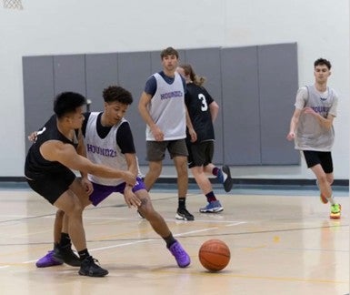 Defender tries to steal the ball from the offensive player!