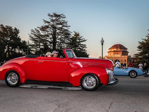 Classic cars driving in the Hot El Camino Cruise Nite event.