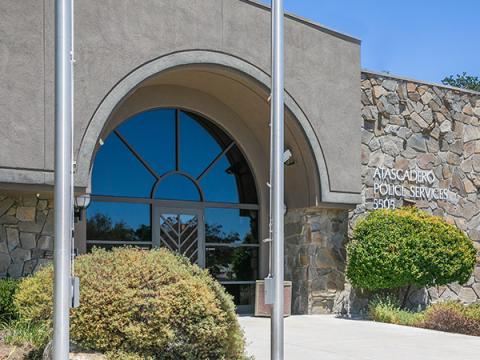 Image of the Police Station with landscaping in front.