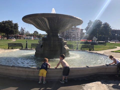 Children playing by the fountain in Sunken Gardens.